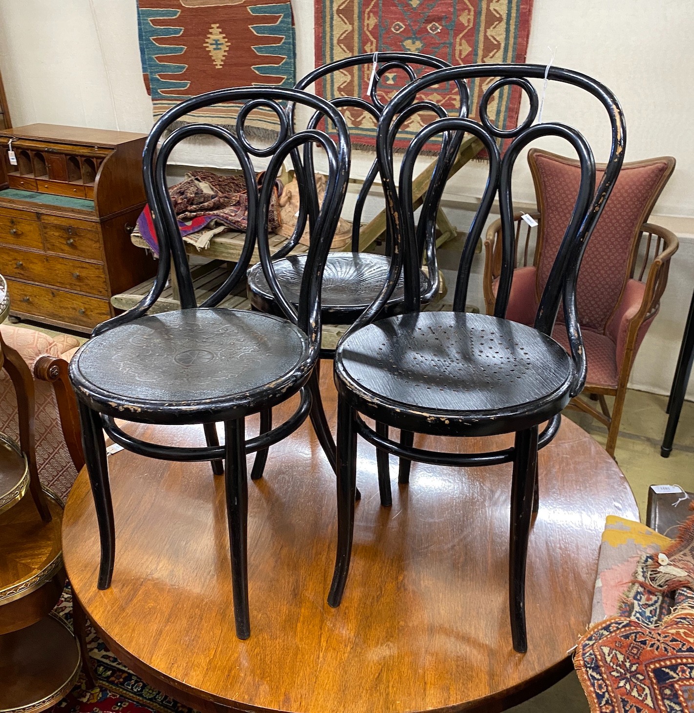 A set of three Thonet ebonised bentwood chairs